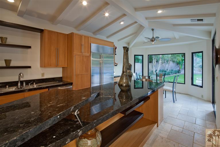70669 Boothill Road Rancho Mirage, CA 92270 - Photo 14 of 27 a room with wooden floor and furniture