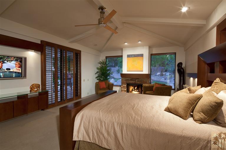 70669 Boothill Road Rancho Mirage, CA 92270 - Photo 19 of 27 a spacious bedroom with a large bed and a flat screen tv