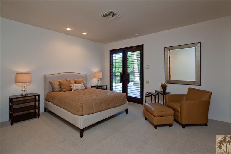70669 Boothill Road Rancho Mirage, CA 92270 - Photo 22 of 27 a bedroom with bed and a couch
