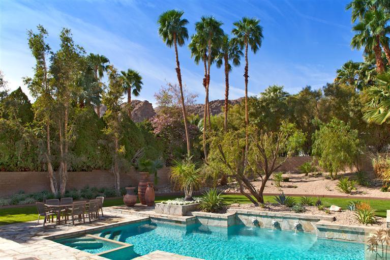 70669 Boothill Road Rancho Mirage, CA 92270 - Photo 25 of 27 a view of backyard with swimming pool and seating space