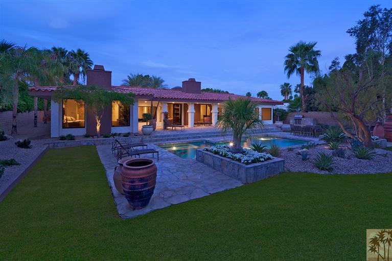 70669 Boothill Road Rancho Mirage, CA 92270 - Photo 3 of 27 a front view of a house with a garden and patio