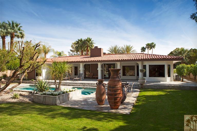 70669 Boothill Road Rancho Mirage, CA 92270 - Photo 4 of 27 a front view of house with yard swimming pool and outdoor seating