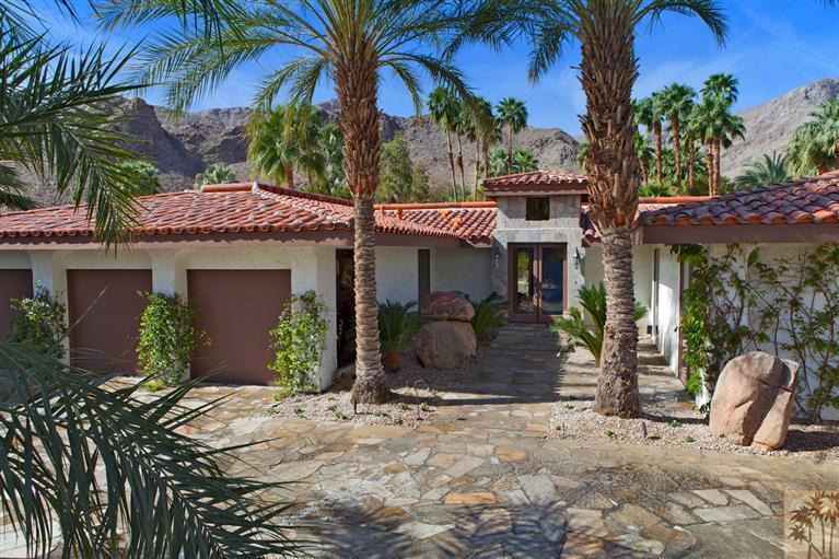 70669 Boothill Road Rancho Mirage, CA 92270 - Photo 6 of 27 a front view of a house with garden