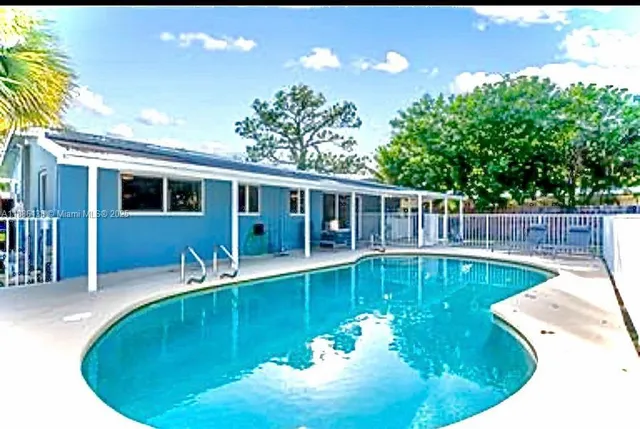 a view of a swimming pool with a patio