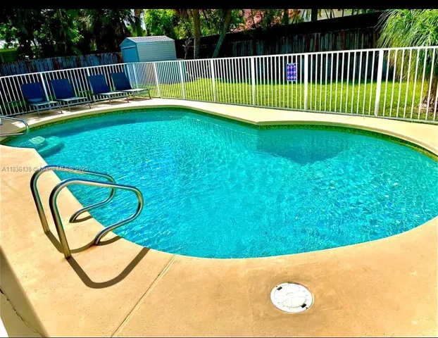 a view of swimming pool having patio