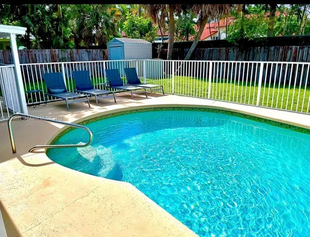 a view of swimming pool and deck