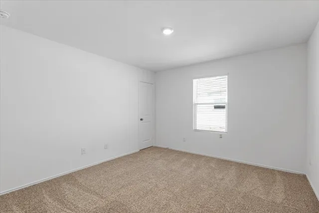 a bathroom with a bathtub shower sink vanity mirror and toilet
