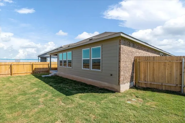 a view of a back yard of the house