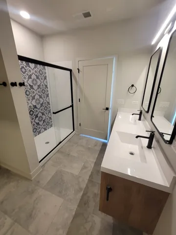 a bathroom with a sink and mirror