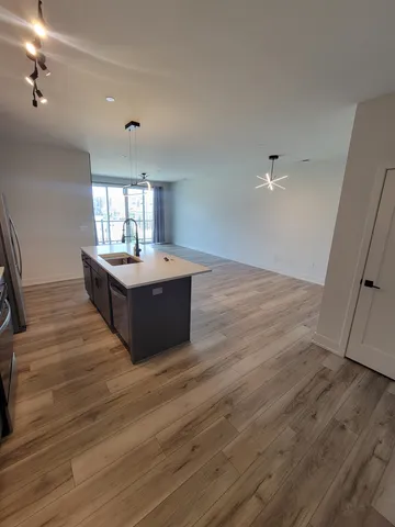 a living room with hard wood floors and a fireplace