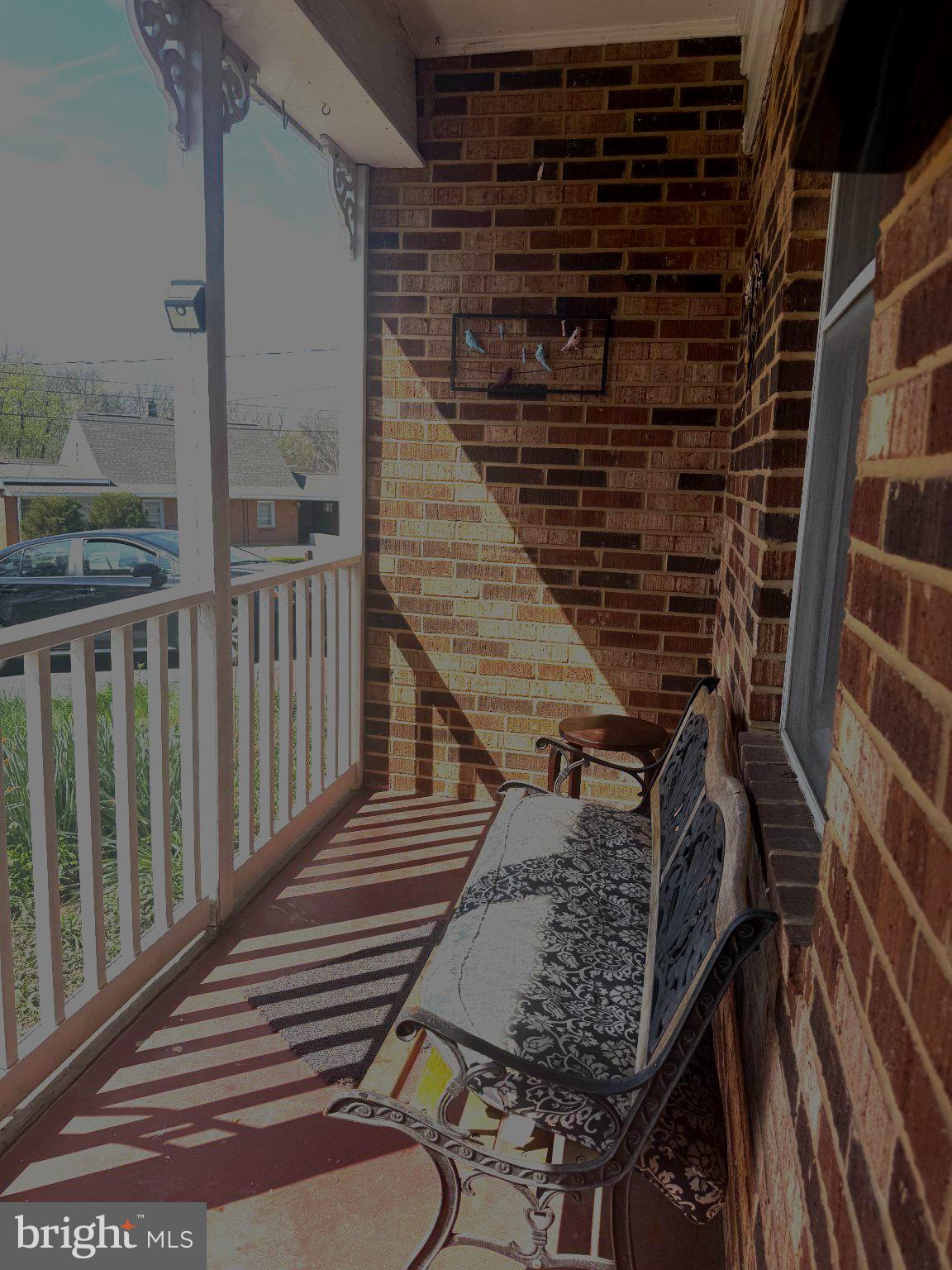 341 West 9th Street Front Royal, VA 22630 - Photo 4 of 21 Charming porch bathed in sunlight.