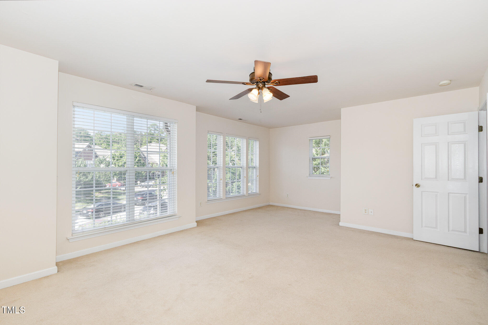 2126 Kedvale Avenue Raleigh, NC 27617 - Photo 12 of 18 a view of room with a ceiling fan and window