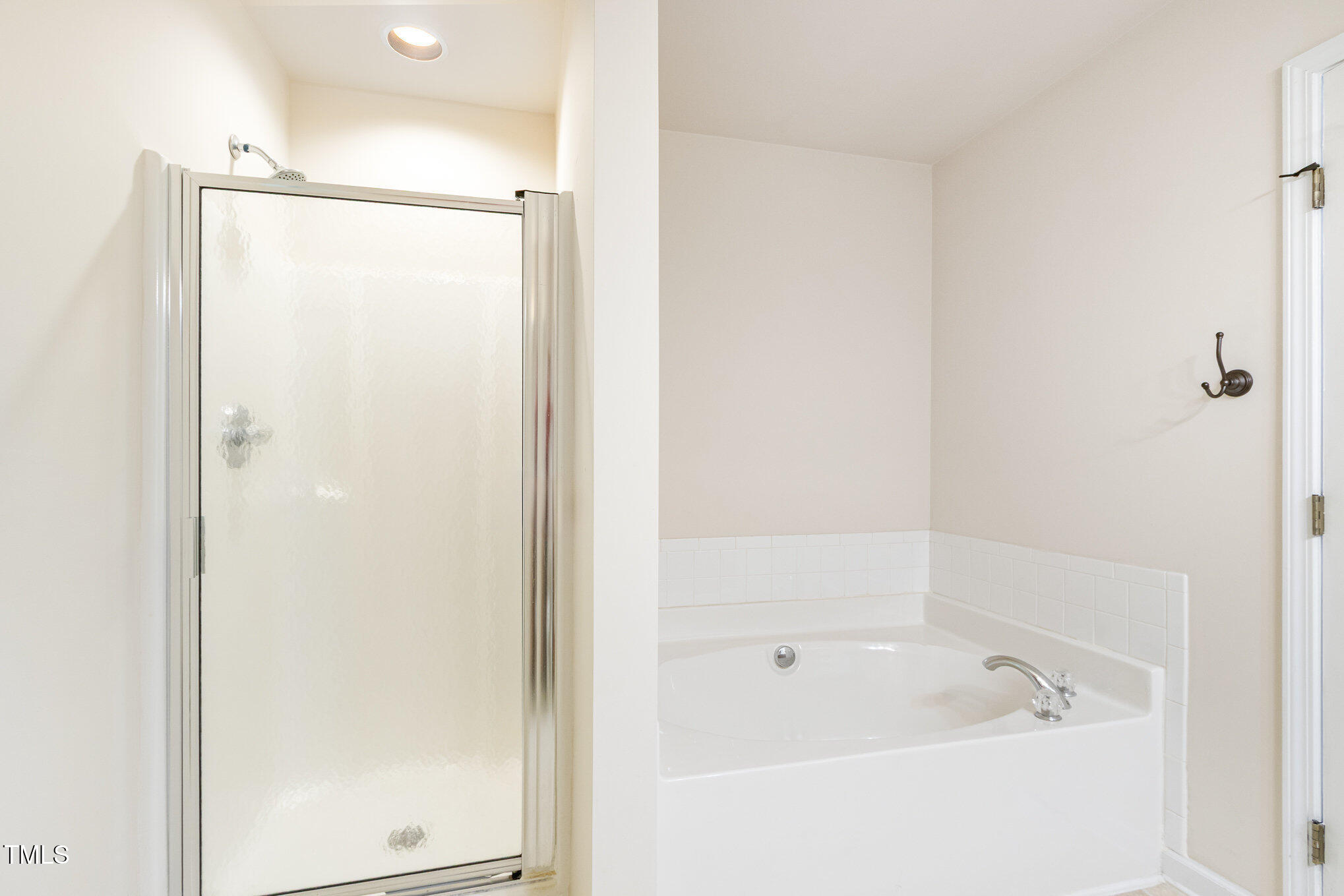 2126 Kedvale Avenue Raleigh, NC 27617 - Photo 15 of 18 a bathroom with a bathtub