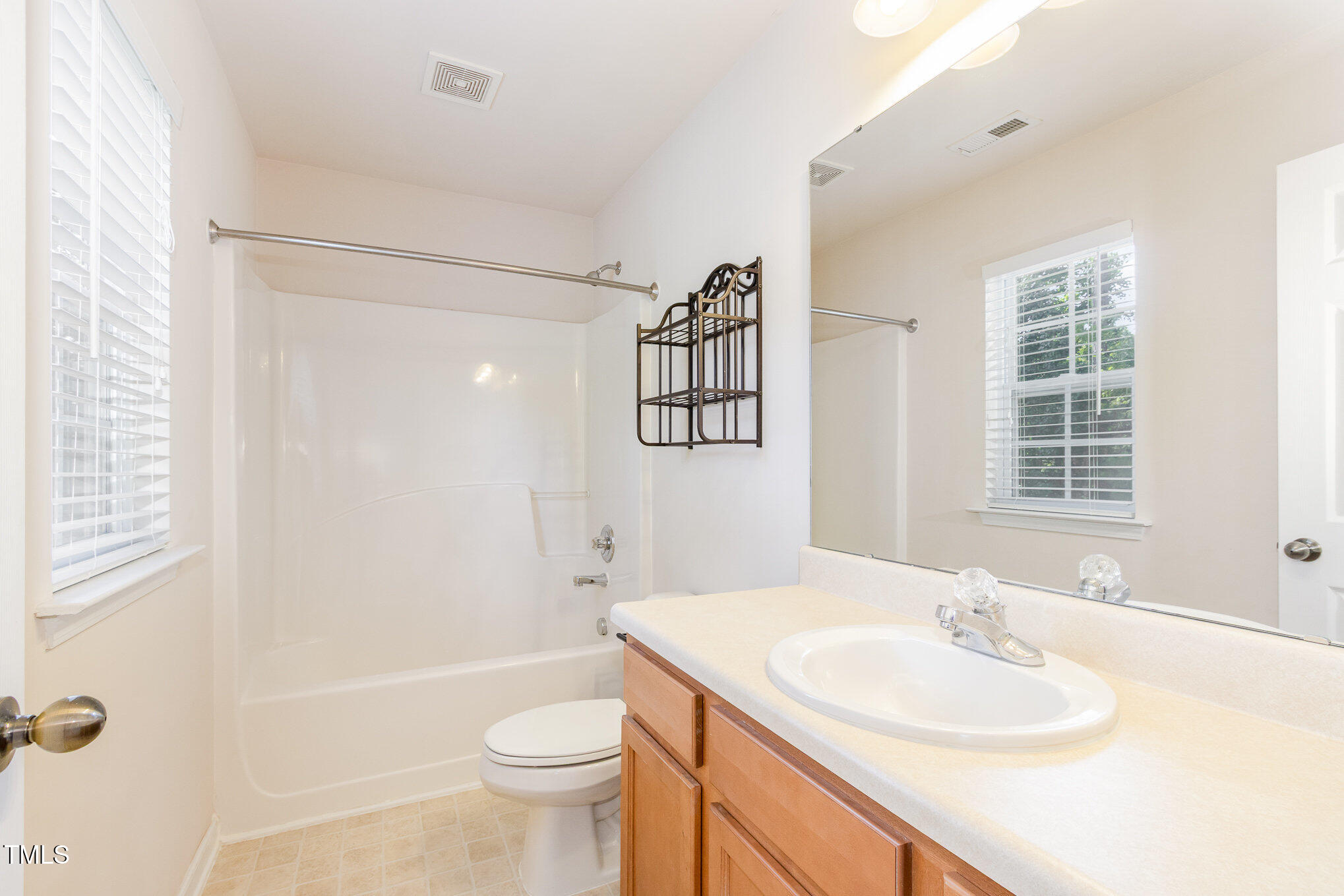 2126 Kedvale Avenue Raleigh, NC 27617 - Photo 17 of 18 a bathroom with a sink a toilet and shower
