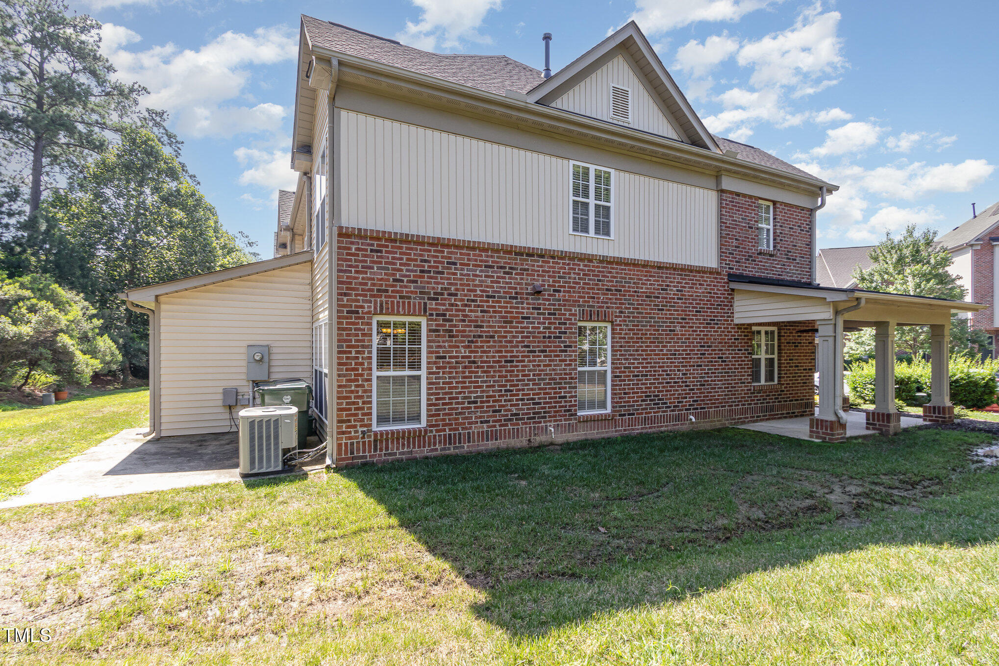 2126 Kedvale Avenue Raleigh, NC 27617 - Photo 18 of 18 a view of a house with a yard and a large tree