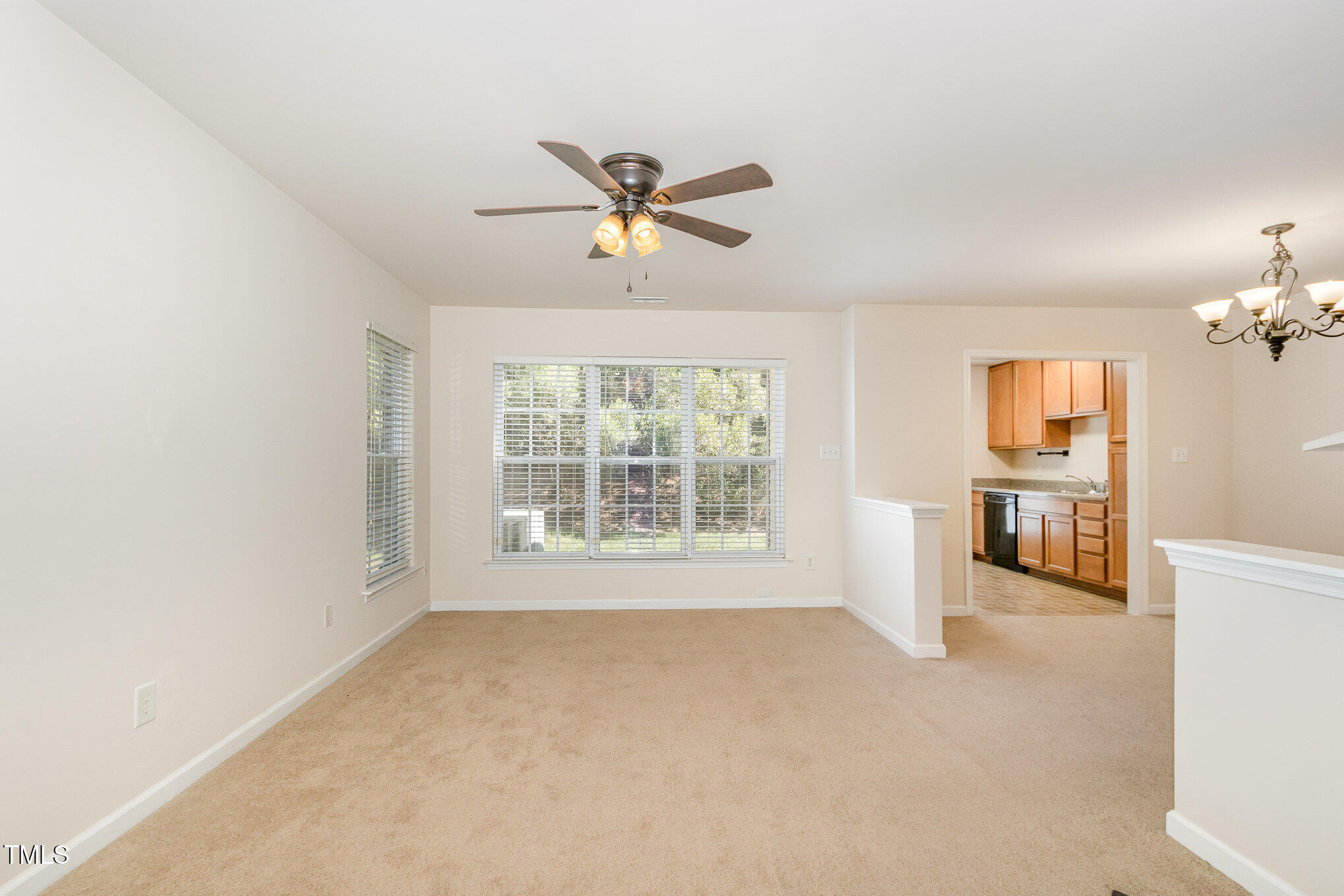 2126 Kedvale Avenue Raleigh, NC 27617 - Photo 5 of 18 a view of a livingroom with a ceiling fan and window