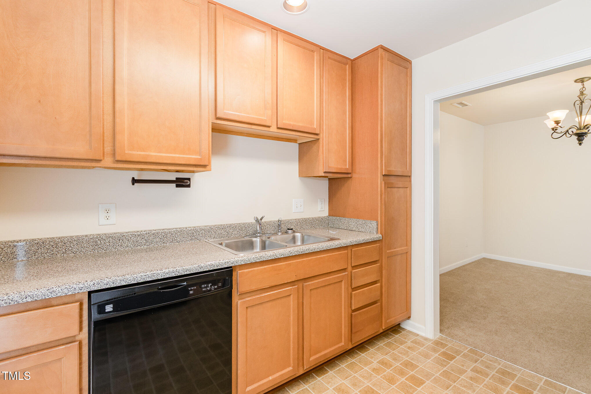 2126 Kedvale Avenue Raleigh, NC 27617 - Photo 10 of 18 a kitchen with stainless steel appliances granite countertop a sink stove and cabinets