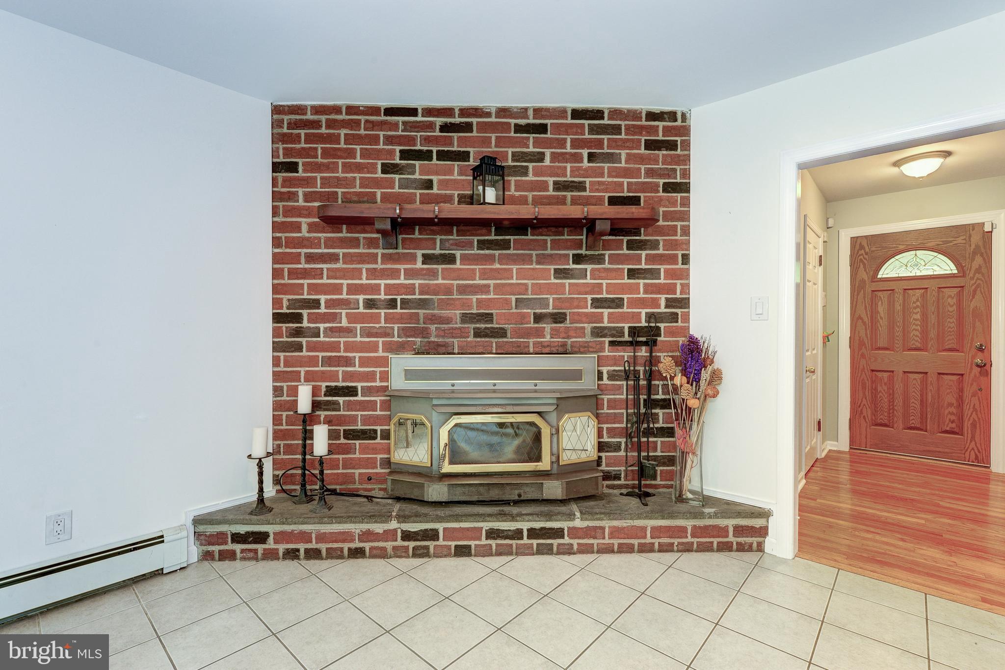 78 Spring Road Malvern, PA 19355 - Photo 16 of 35 wood burning stove/fireplace in kitchen