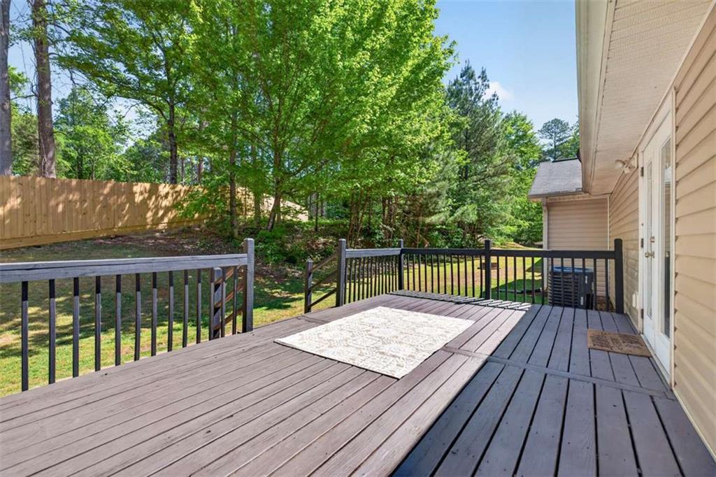 386 Ridgewood Drive Pendergrass, GA 30567 - Photo 40 of 50 a balcony with wooden floor and fence