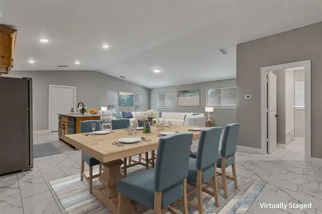 a view of a dining room with furniture
