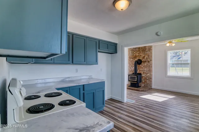 a kitchen with a cabinets and window