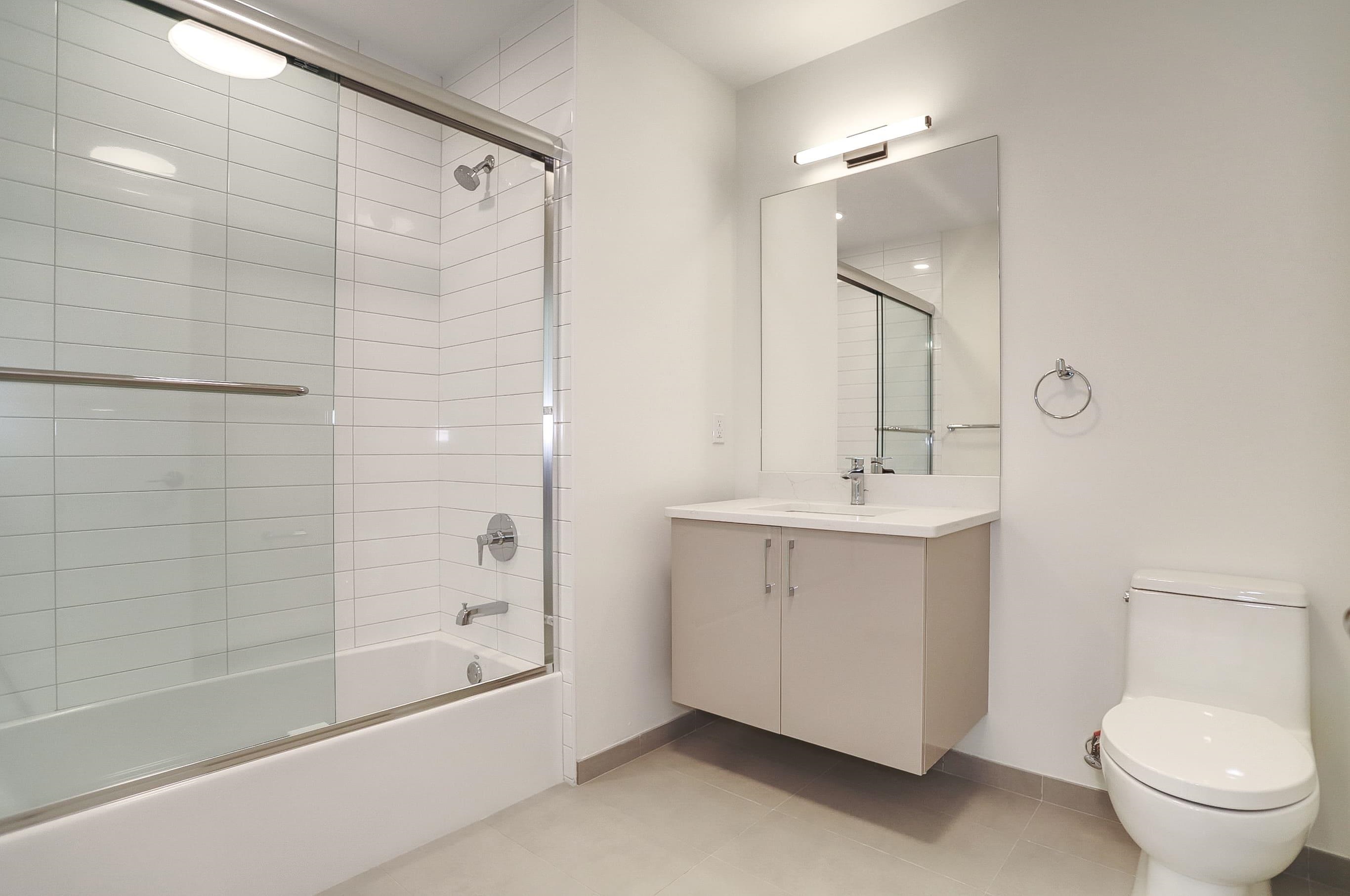 303 Madison Street, Unit 306 Hoboken, NJ 07030 - Photo 20 of 24 a bathroom with a sink a toilet and shower