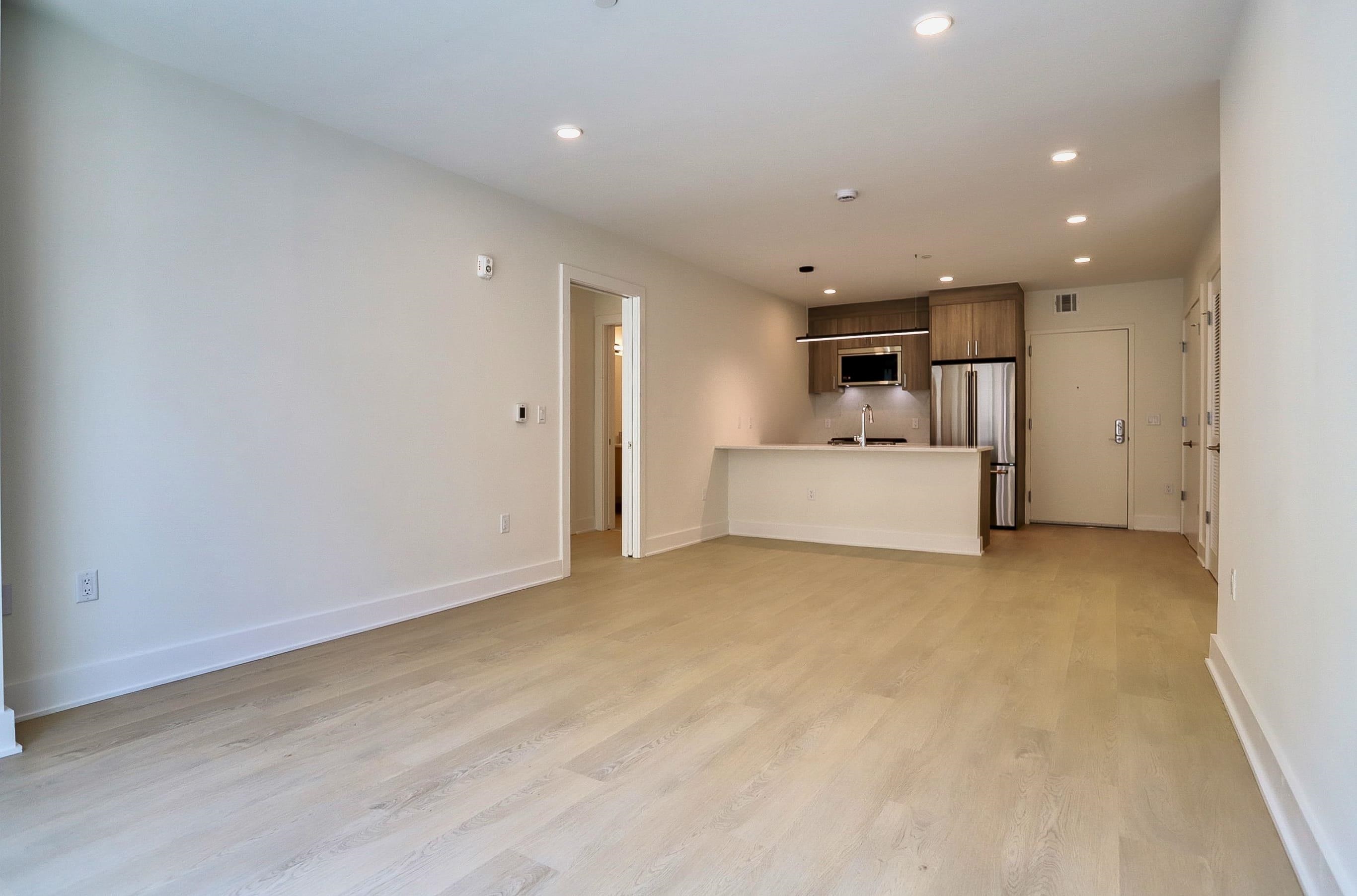 303 Madison Street, Unit 306 Hoboken, NJ 07030 - Photo 6 of 24 a view of a livingroom with a kitchen