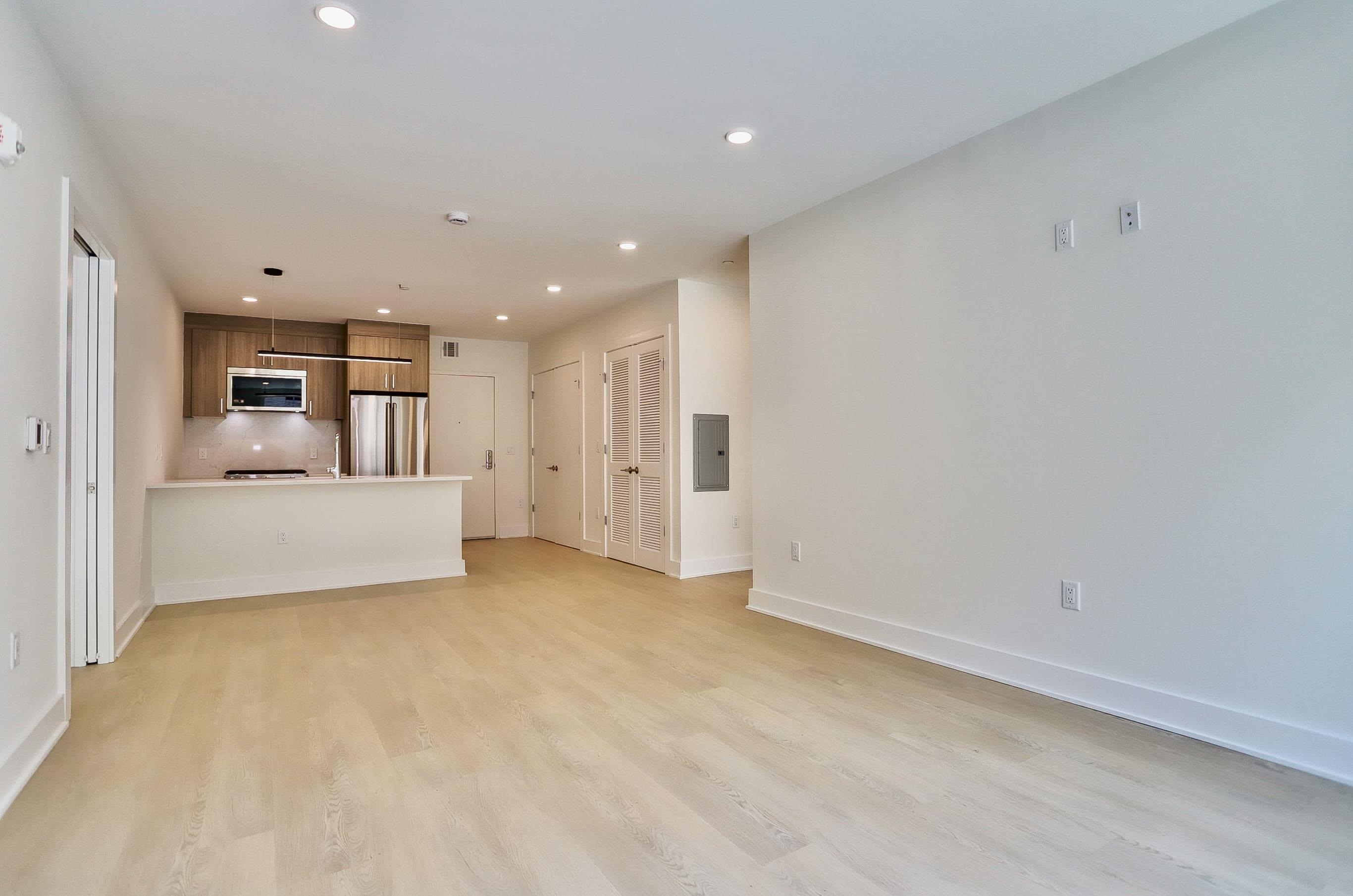 303 Madison Street, Unit 306 Hoboken, NJ 07030 - Photo 8 of 24 a view of a kitchen with white cabinets