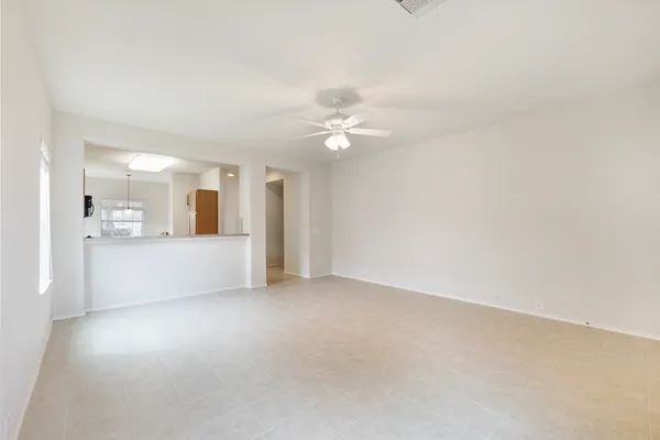 a view of a kitchen with a sink and a chandelier