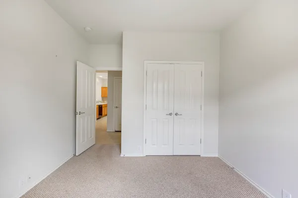 a view of room with windows and bathroom view