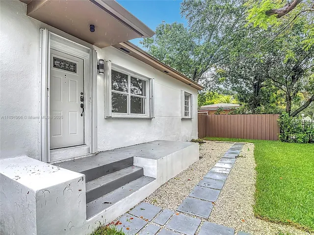 a house view with a backyard space