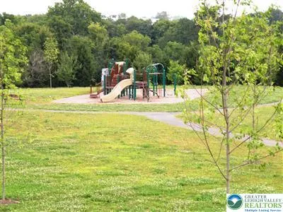 a view of a swimming pool with a yard