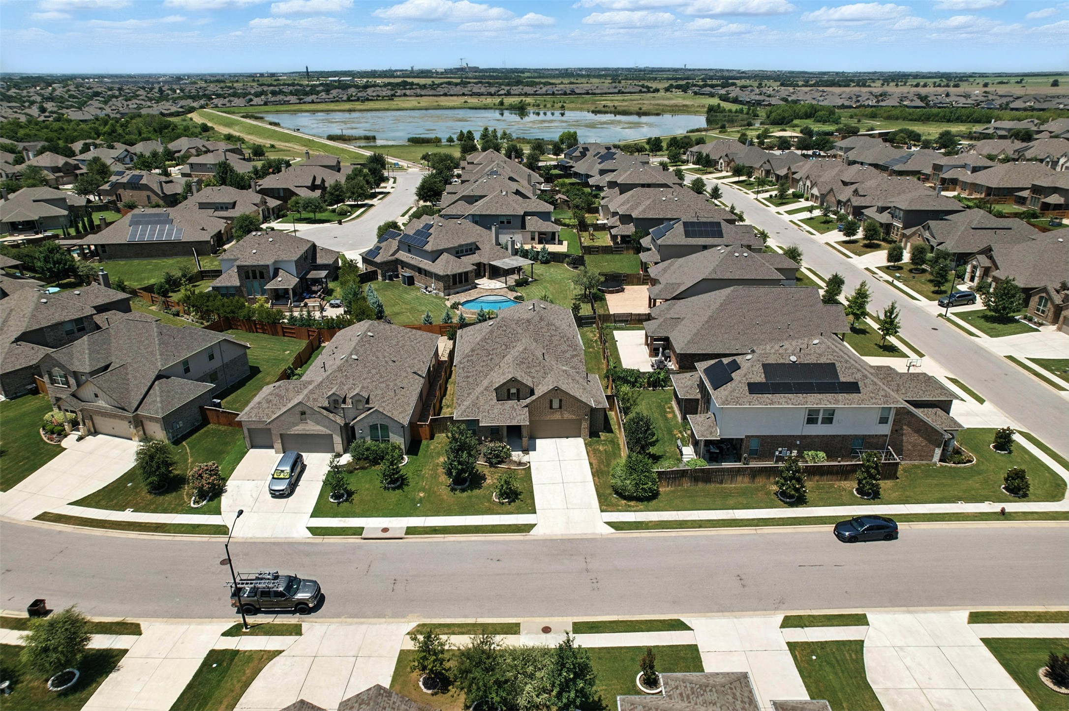 3054 Columbus Loop Round Rock, TX 78665 - Photo 36 of 40 Aerial perspective of suburban area with a nearby body of water