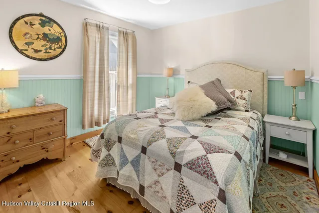 a bathroom with a toilet and a shower curtain