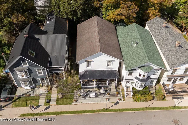 an aerial view of houses with outdoor space