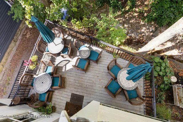 a blue and white umbrella sitting in front of a house