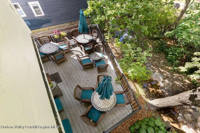 a view of a chairs and table in a patio