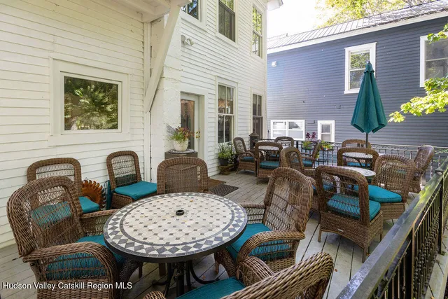 a view of a chairs and table in the patio