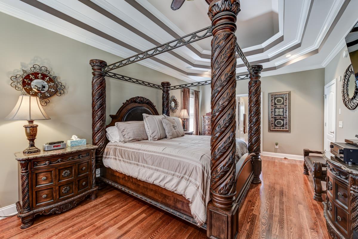 3338 Allen Barrett Road Murfreesboro, TN 37129 - Photo 11 of 27 a bedroom with a bed and a chandelier