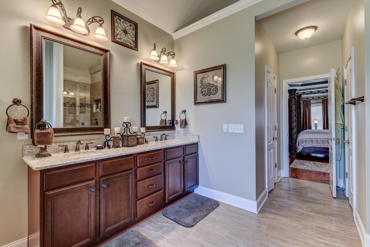 3338 Allen Barrett Road Murfreesboro, TN 37129 - Photo 13 of 27 a en suite bathroom with double vanity sinks and a mirror