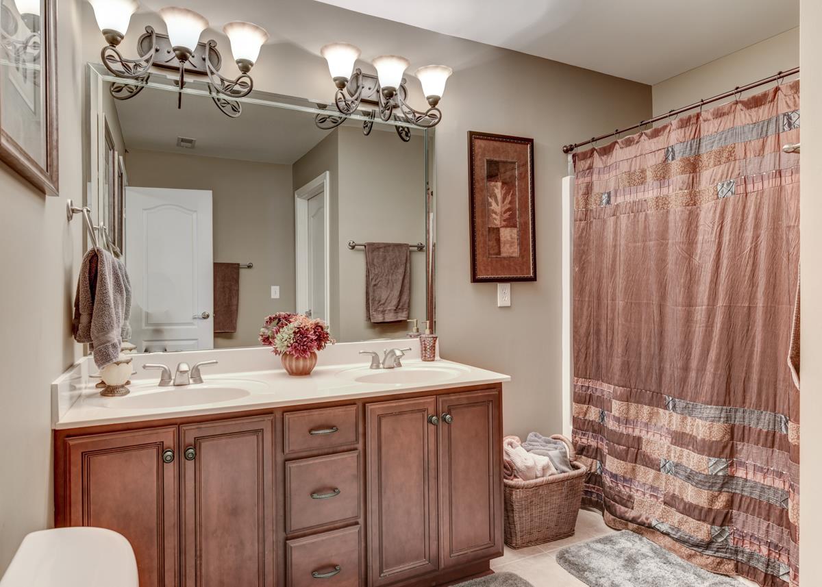 3338 Allen Barrett Road Murfreesboro, TN 37129 - Photo 20 of 27 a bathroom with a double vanity sink mirror and toilet