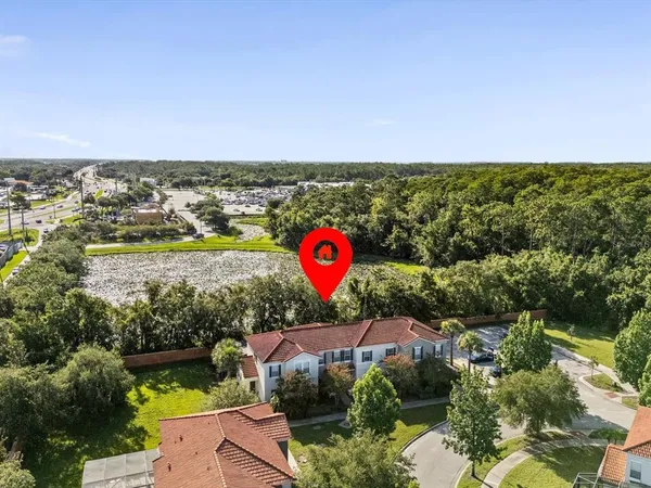 an aerial view of residential house and outdoor space