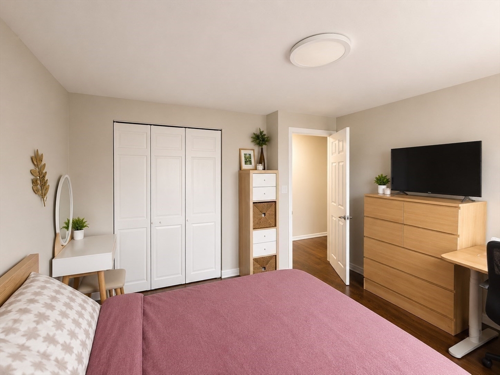 43 Colborne Road, Unit 4 Boston, MA 02135 - Photo 10 of 11 a bedroom with a bed and flat screen tv
