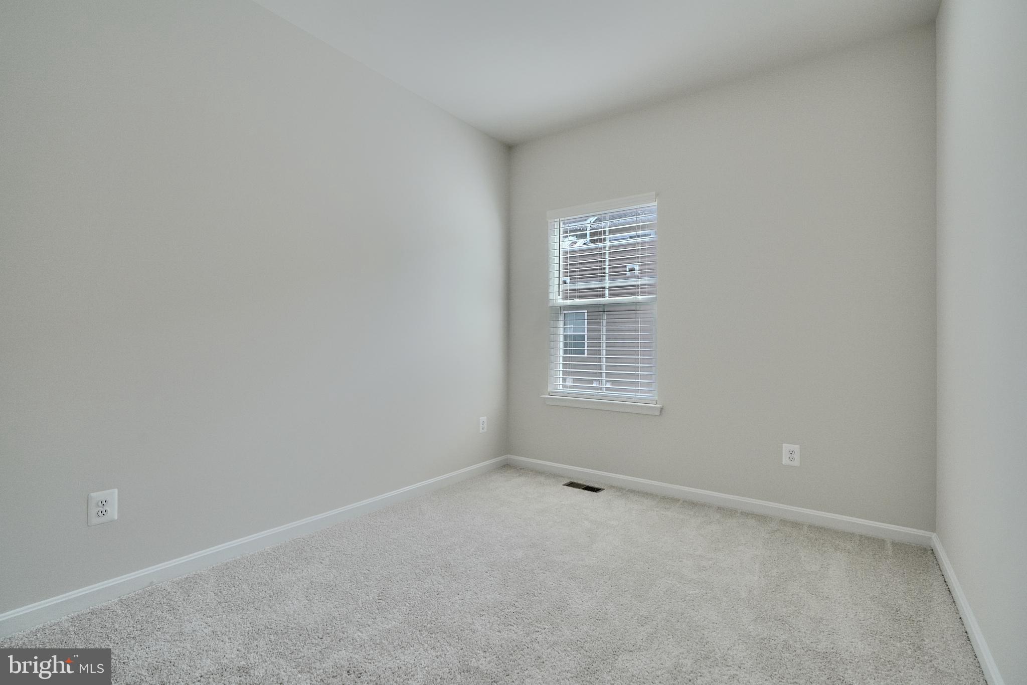 2509 Gatwick Lane, Unit 60 Frederick, MD 21701 - Photo 17 of 30 an empty room with windows