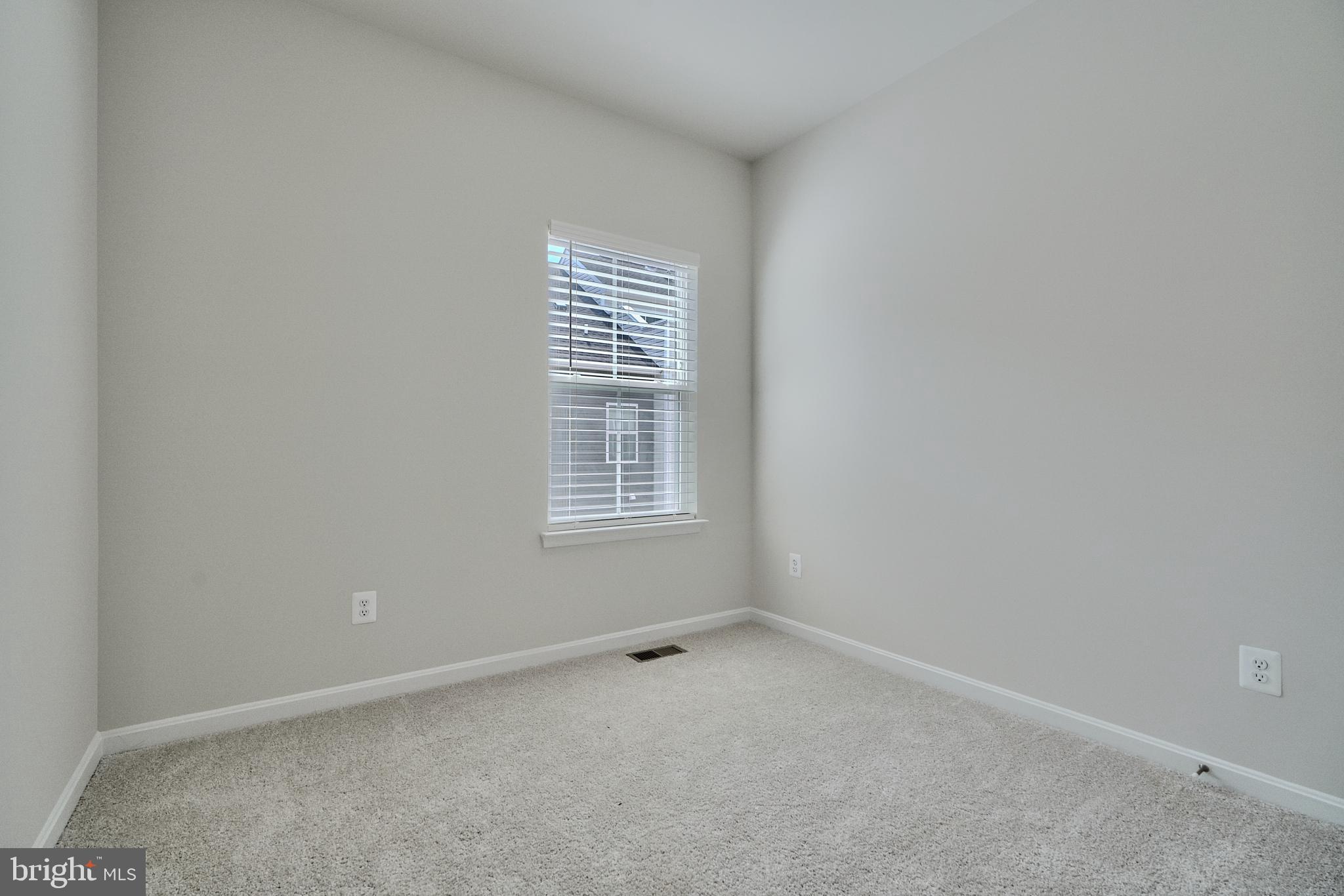 2509 Gatwick Lane, Unit 60 Frederick, MD 21701 - Photo 18 of 30 an empty room with a window