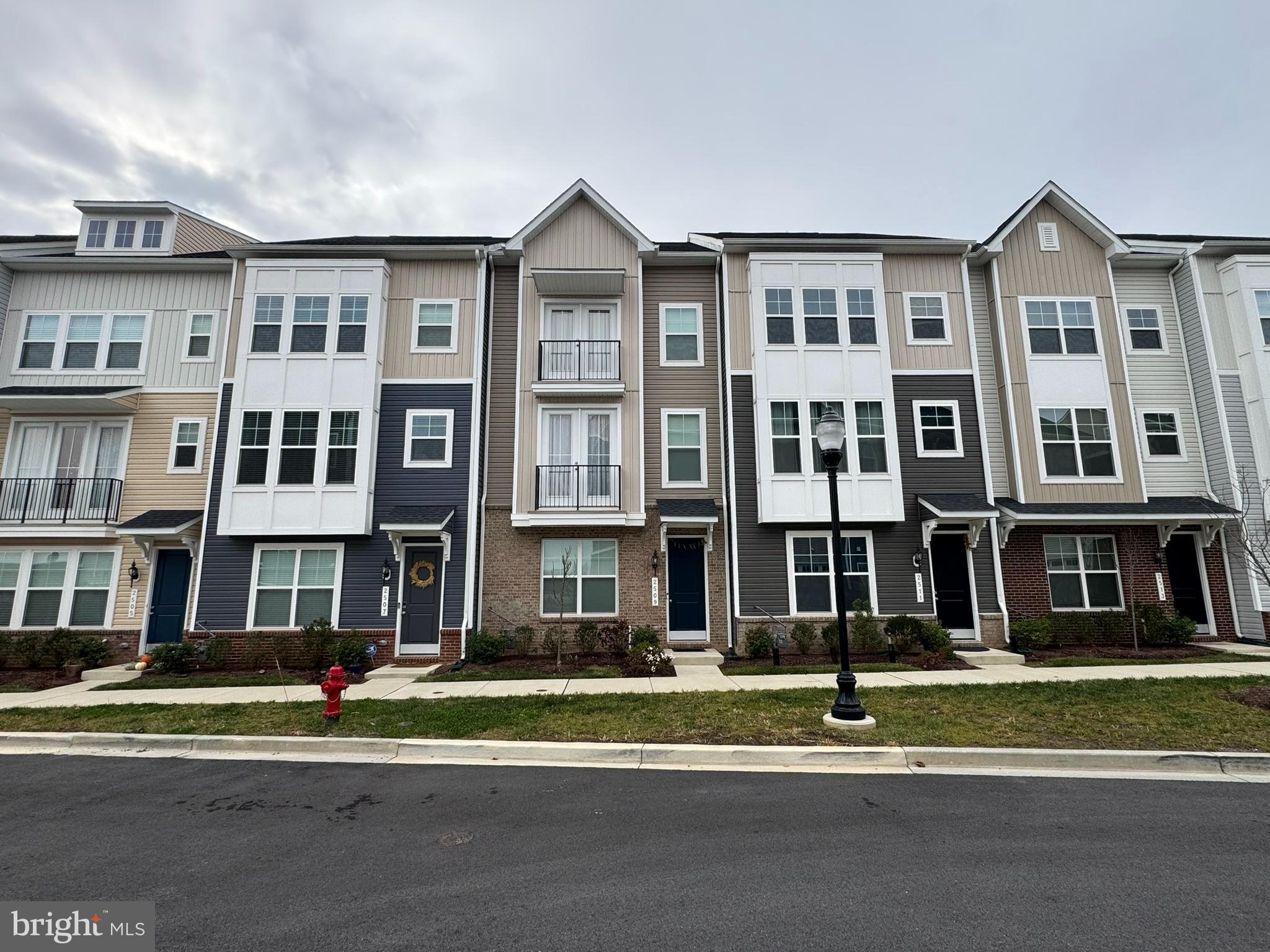 2509 Gatwick Lane, Unit 60 Frederick, MD 21701 - Photo 2 of 30 a view of a brick building next to a yard