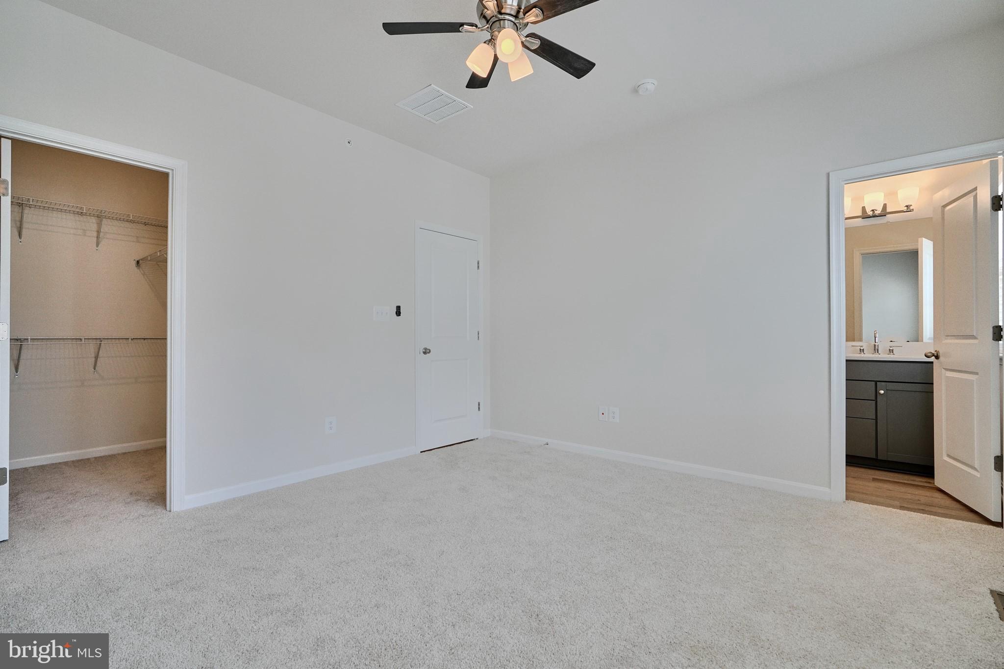 2509 Gatwick Lane, Unit 60 Frederick, MD 21701 - Photo 24 of 30 a view of an empty room with a ceiling fan