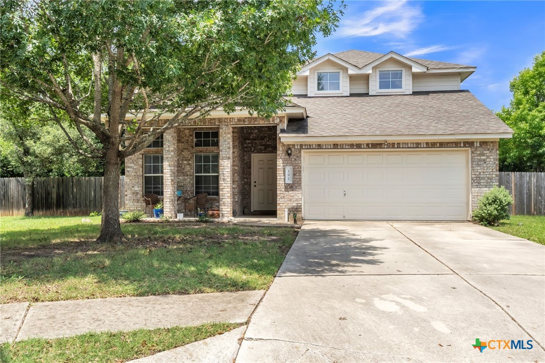 101 Cannery Cove Leander, TX 78641 - Photo 1 of 40 a front view of a house with a yard