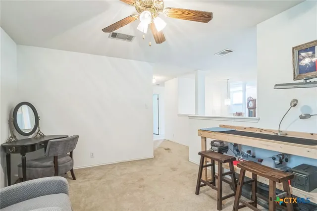 a bedroom with a bed and a television