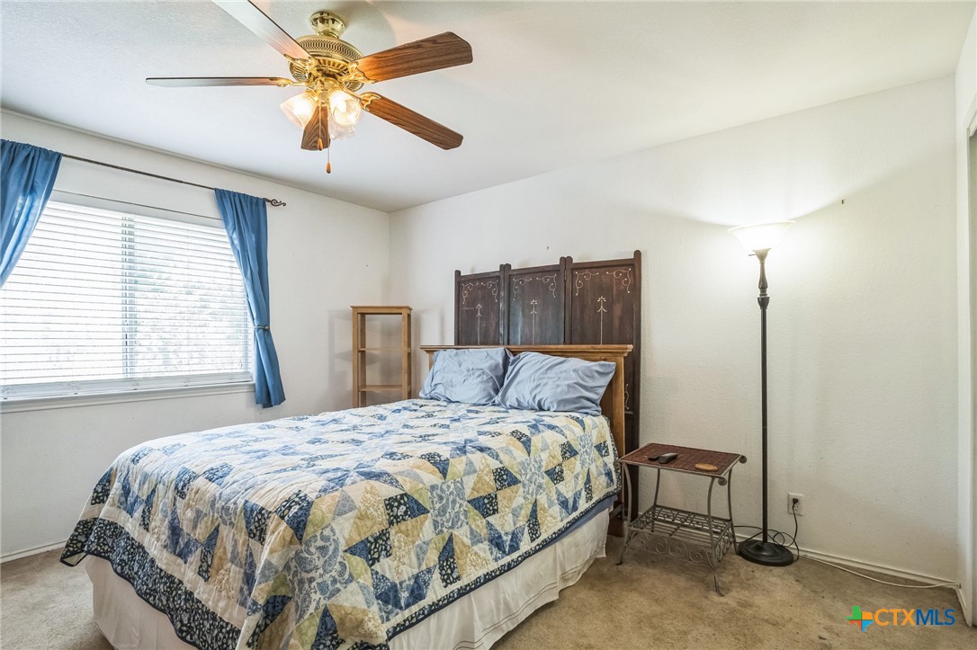 101 Cannery Cove Leander, TX 78641 - Photo 18 of 40 a bedroom with a bed and a window